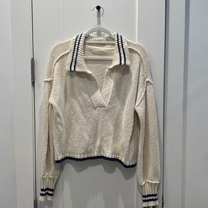 cream collared sweater with blue stripes